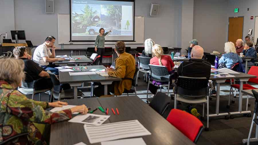 Brittany Brand leads a workshop, with about 25 Ashland residents