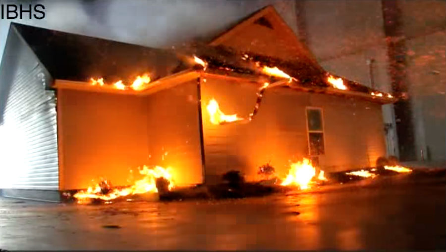 A huge burn test lab in North Carolina, flammable vegetation at the base of a house and pine needles in gutters catch on fire.
