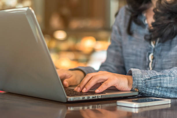 Female student sitting at a computer.