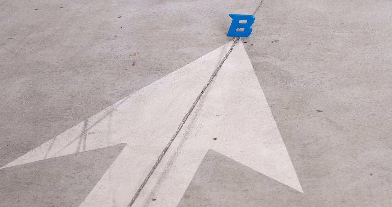 arrow pointing to Boise State B logo