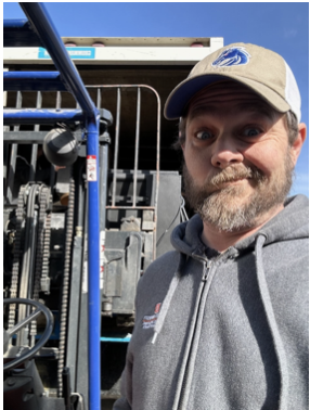 Jeremy Shaw in a hoodie with a Boise State hat.