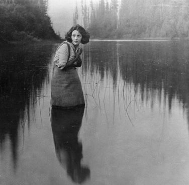 Shipman standing in a lake