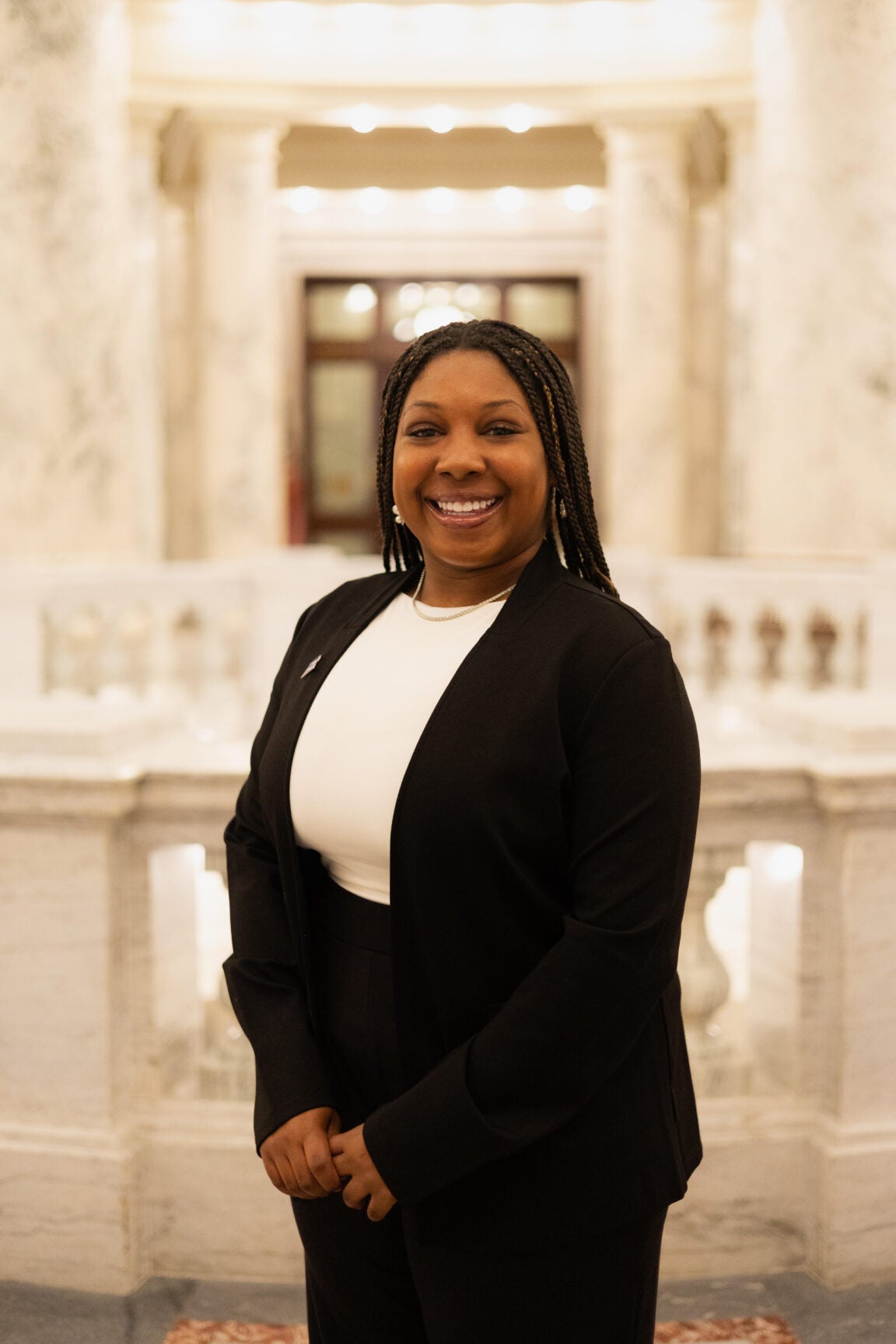 Madison Kincaid standing in the Idaho Capitol Rotunda, smiling
