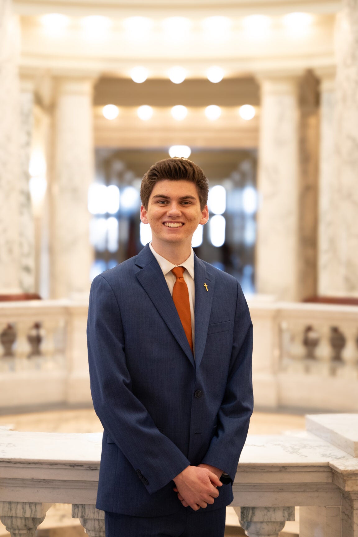 Billy Kidd standing in the Idaho Capitol Rotunda, smiling
