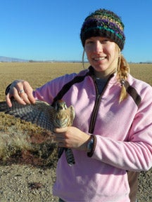 Allie Anderson holding a Kestrel