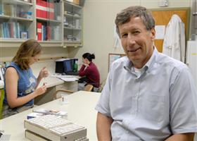 Alfred in lab with students