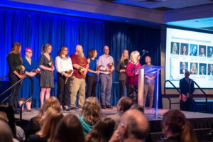 Writing award winners on stage