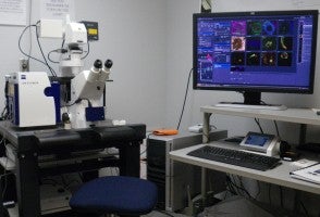 microscope and computer in lab
