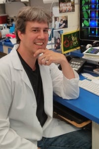 Matthew Ferguson smiling in his office