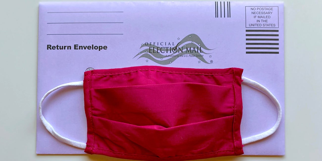 a return envelope for election, covered with a facemask
