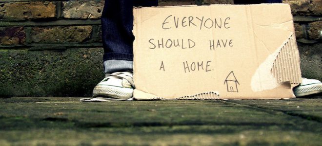 Cardboard sign with text everyone should have a home
