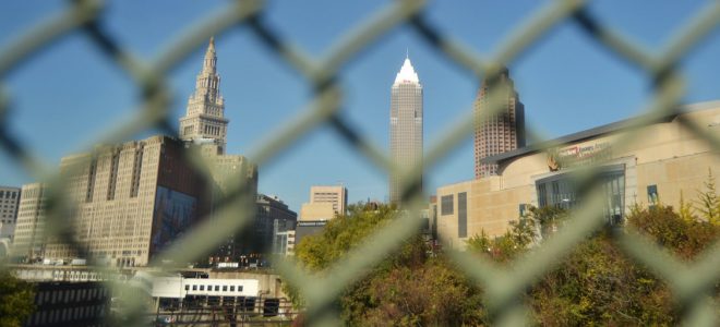 Highrise buildings through chain link fence