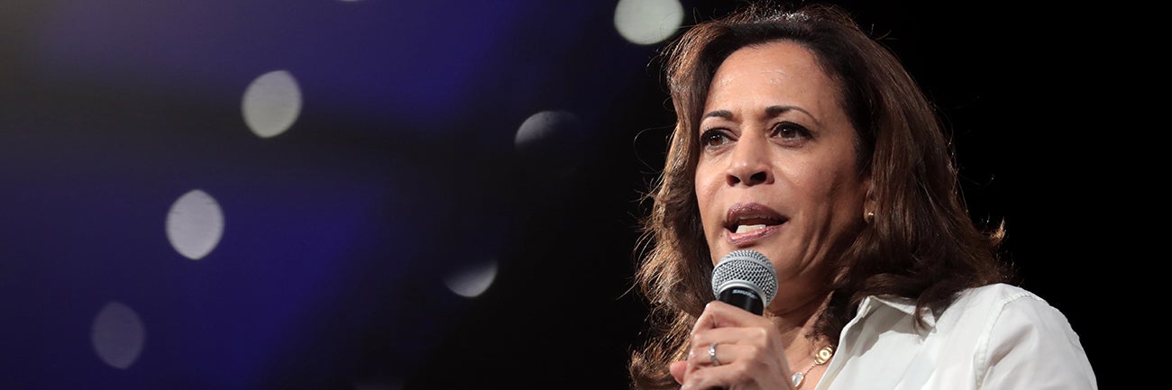 kamala harris speaking in a microphone