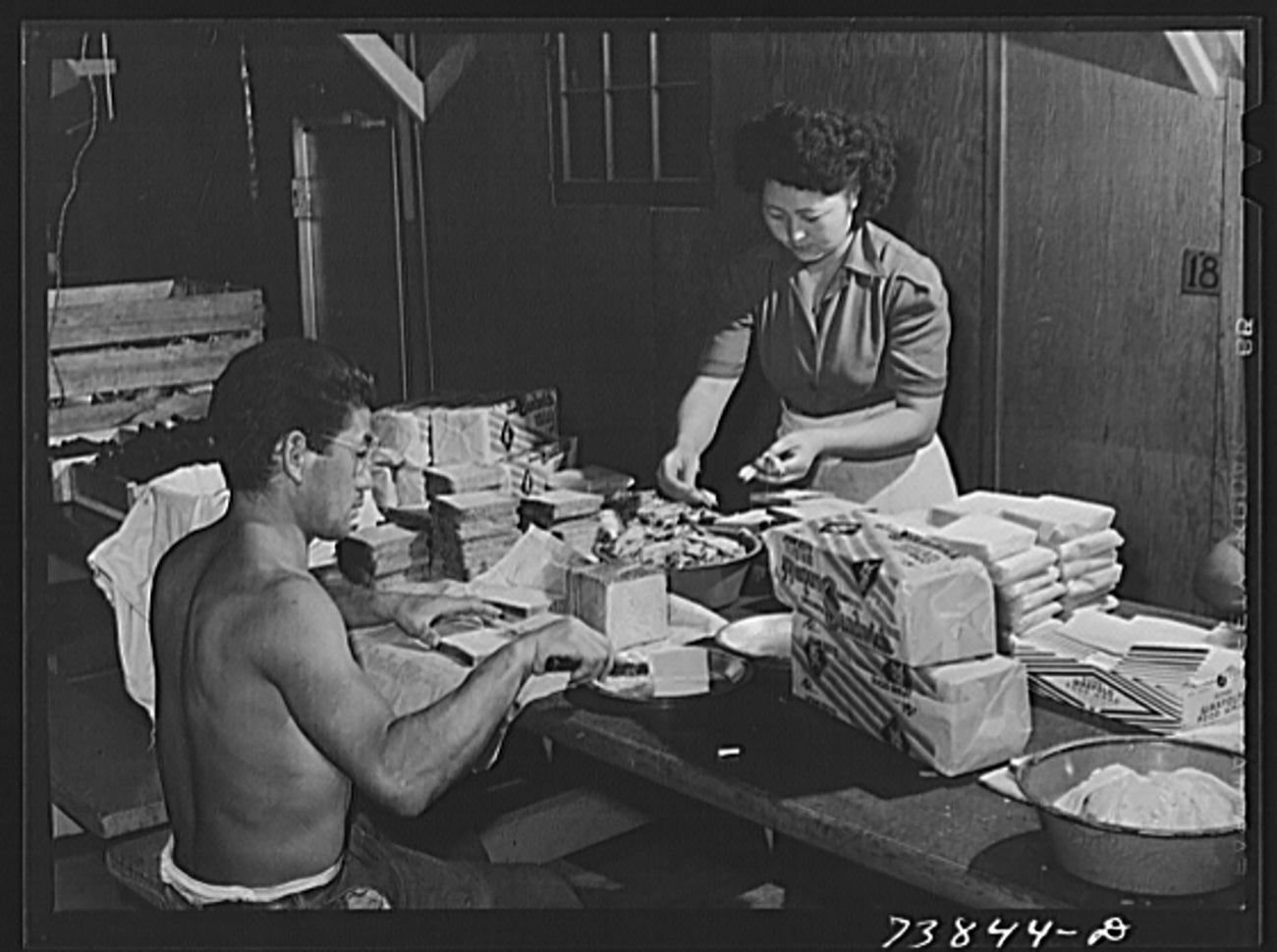 woman and man cooking