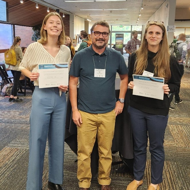 Kate holds award with two other participants