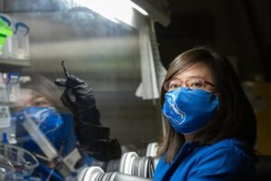 Claire Xiong working with lab equipment