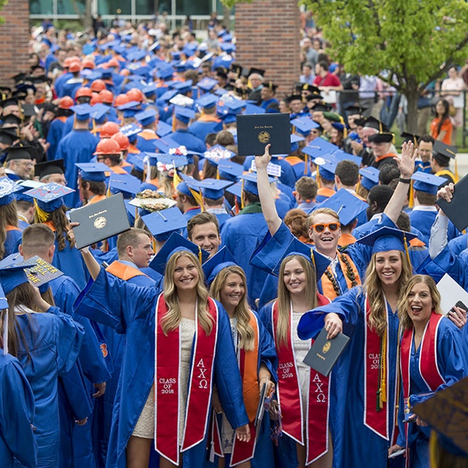 Graduates walking out of commencement
