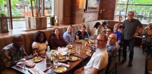 Members of the Dairy NutriSols team sit down to breakfast