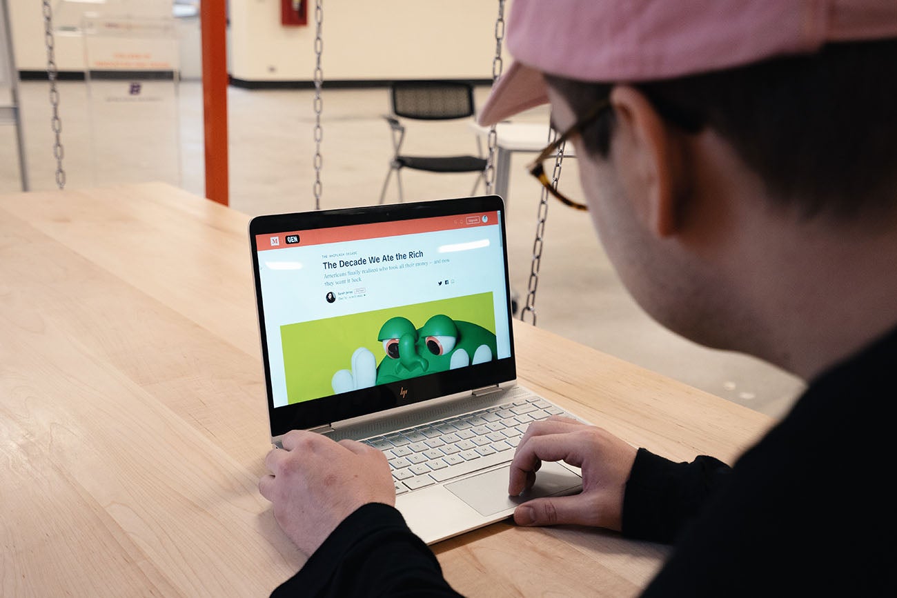 Brennon browsing one of his own articles