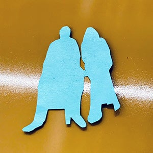 Printmaking cutout of two figures