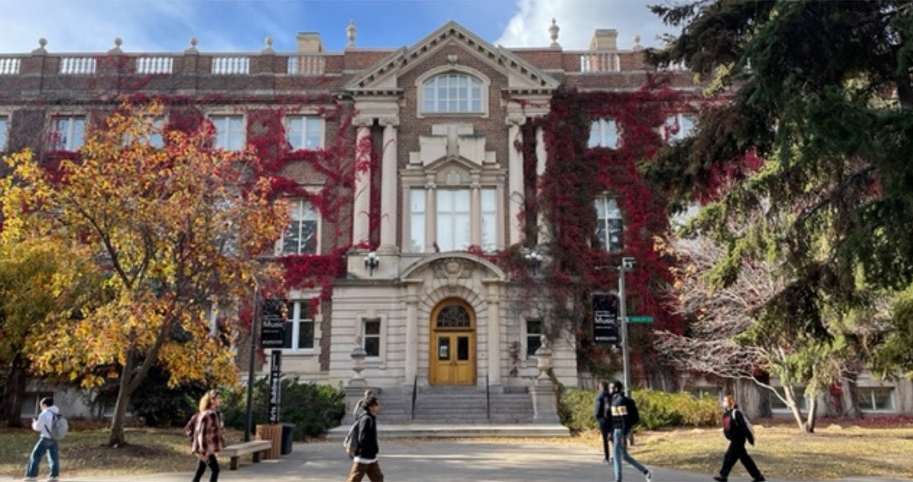 People walking in front of The Wirth Institute at the University of Alberta in Canada