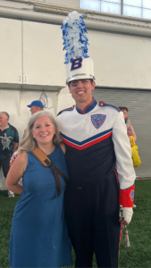 Jacob Scott in Blue Thunder uniform smiles alongside Nicole Molumby