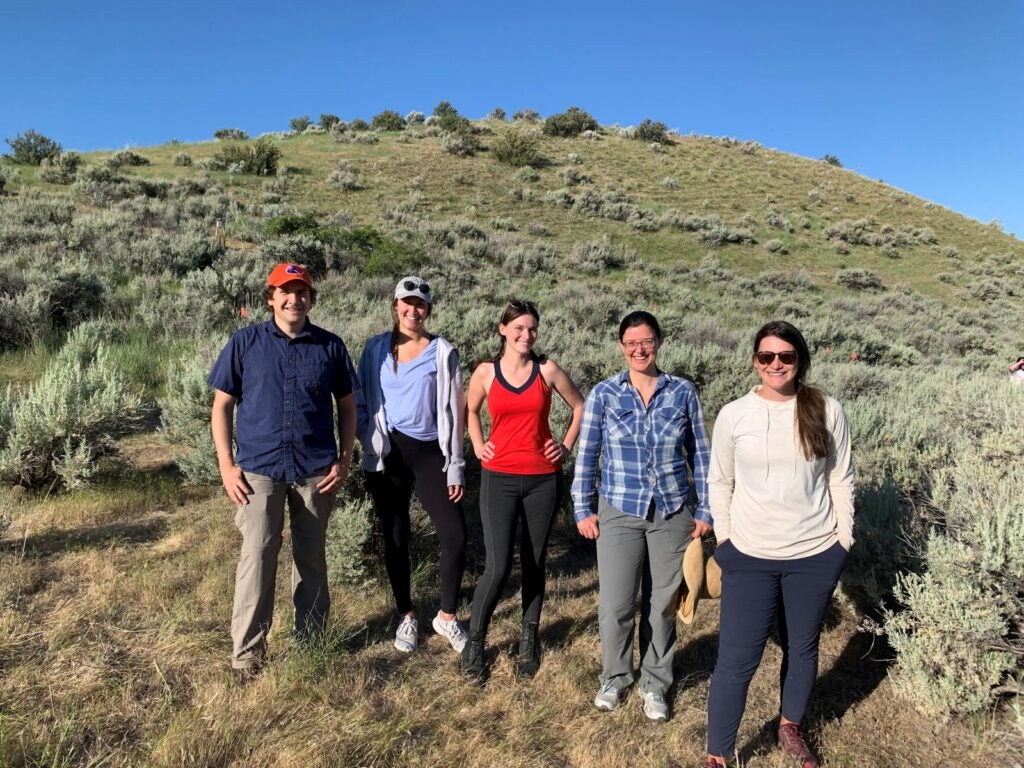 Boise State biology researchers posing for a group photo in the Idaho foothills