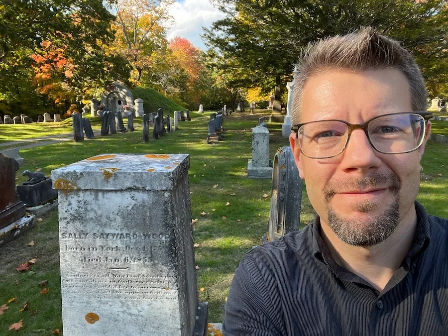 Professor Tom Hillard at the headstone of Gothic Novelist Sally Wood.