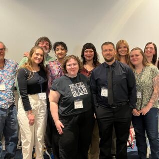 Boise State sociology students posing for a group photo at a conference
