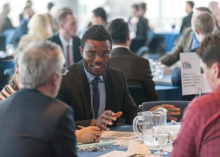 professional gathering, student engaged in conversation
