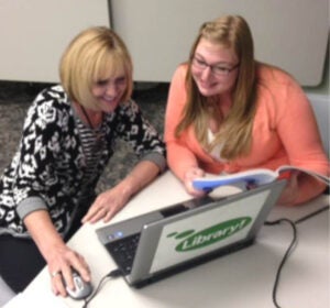 student helping client file tax returns