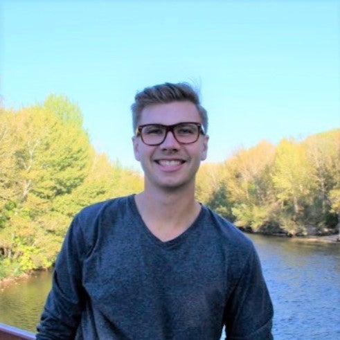 Brian Krannsan standing on a bridge near the Boise River