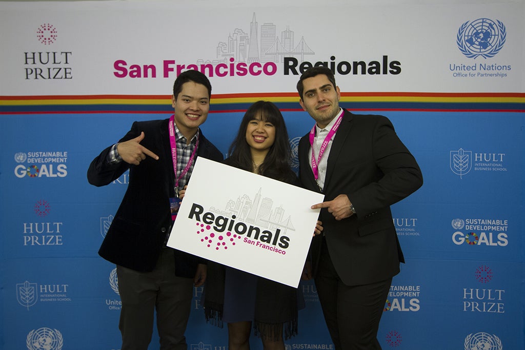 group members holding regionals sign