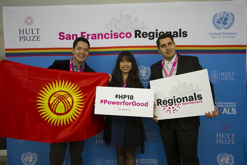 group members holding flag and signs at regionals