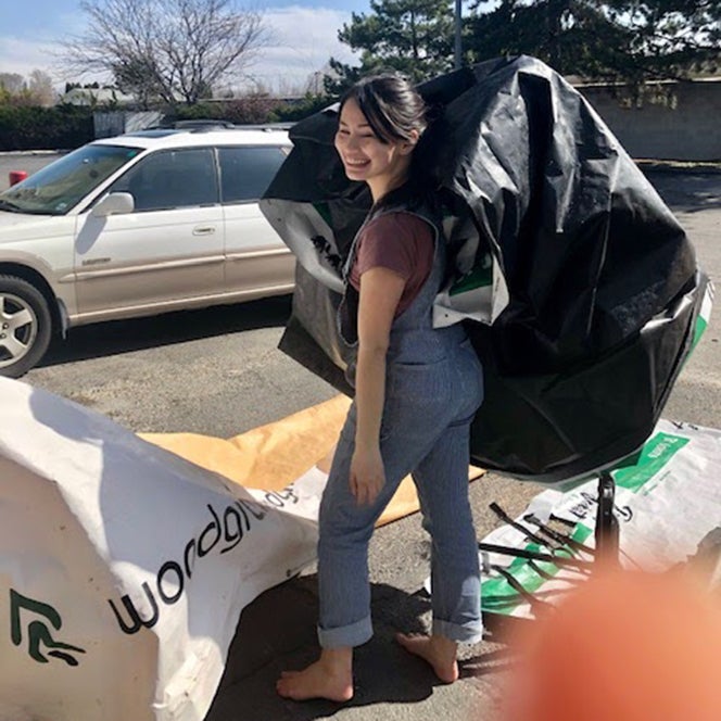 woman preparing lumber wrap for recycling