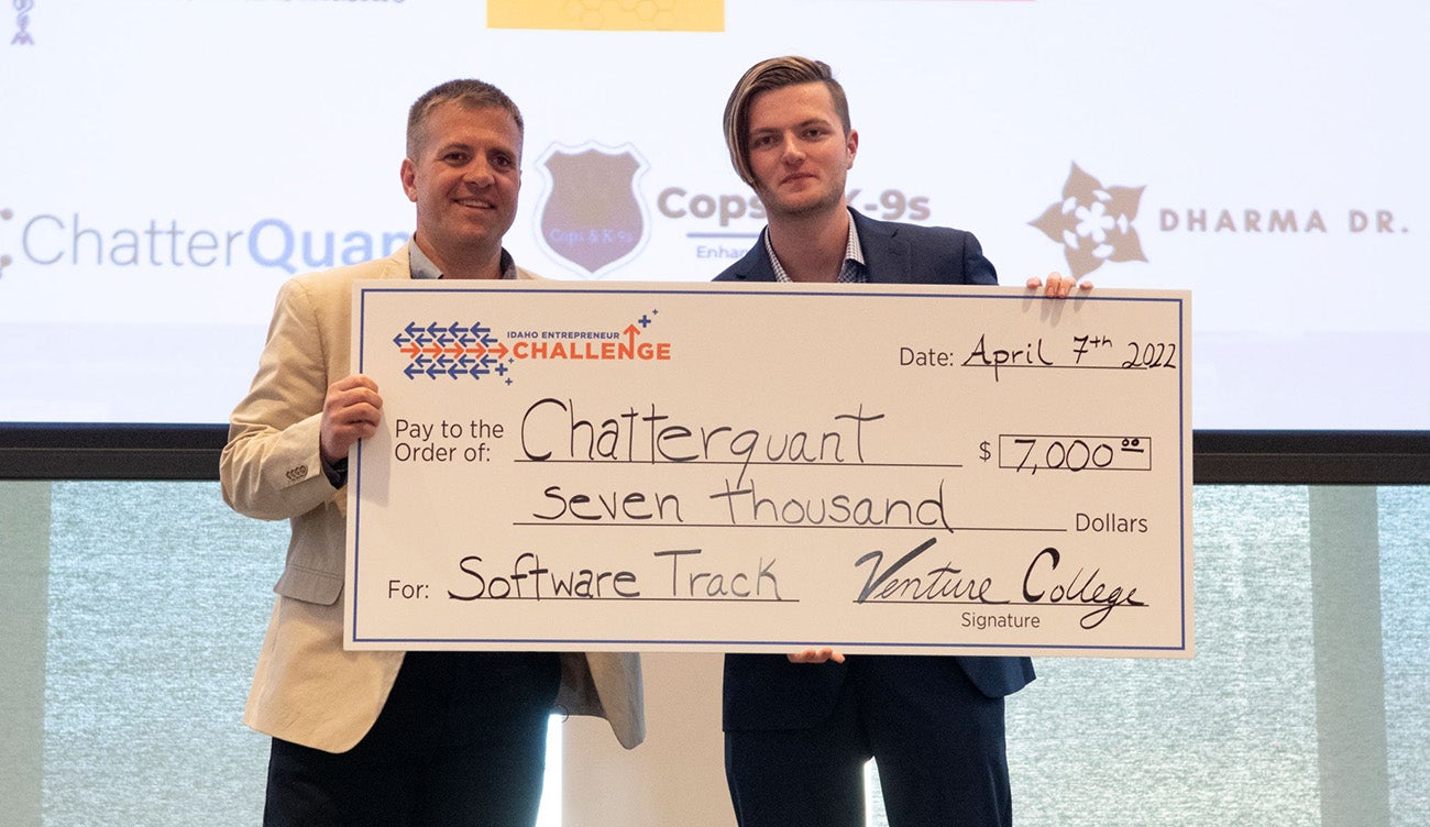 Christian Perry holding bid check