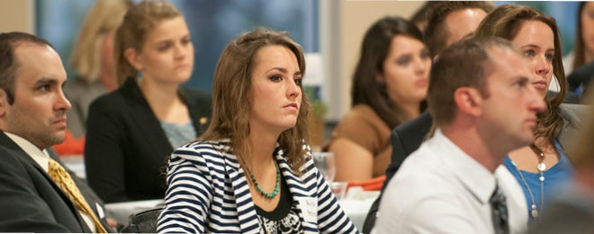 business people sitting at a conference