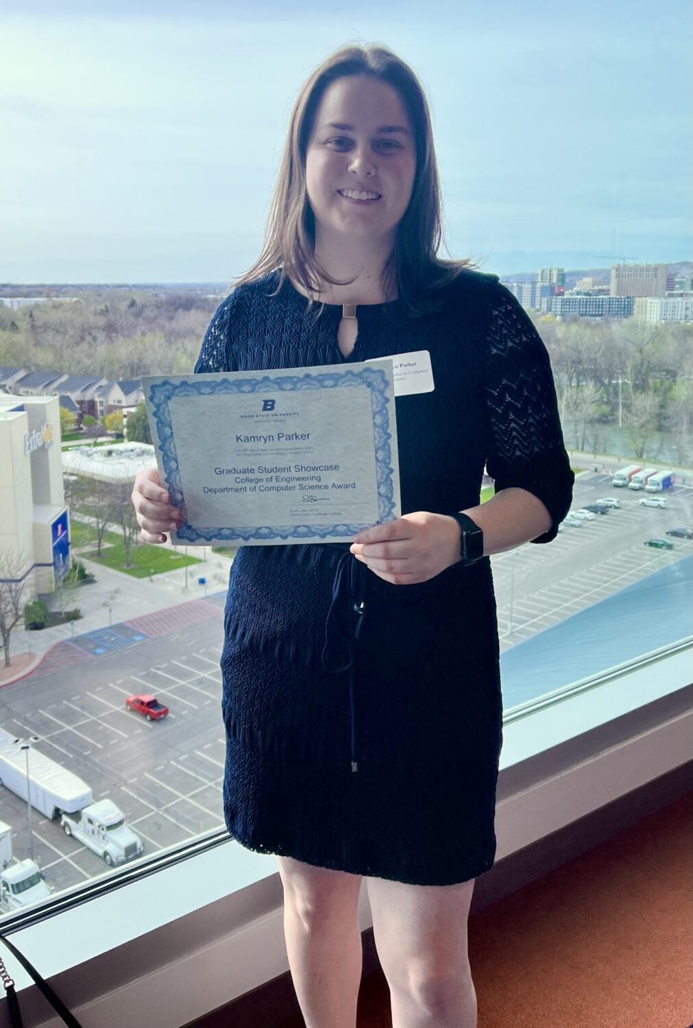 Photo of Kamryn holding her award certificate