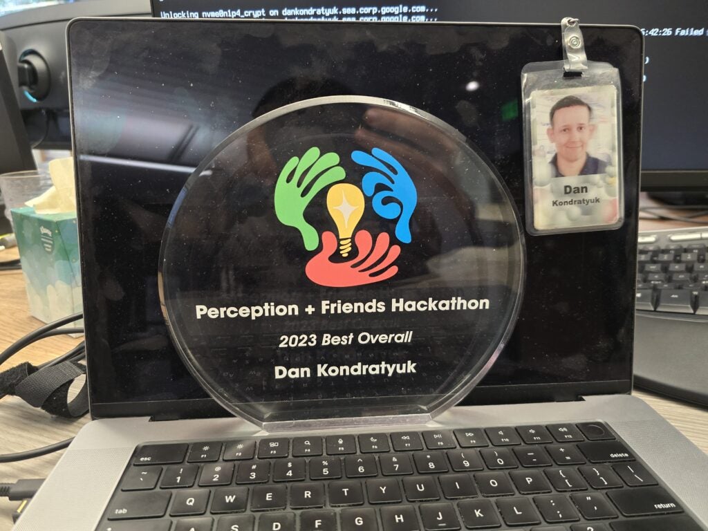 Photo of glass trophy labeled, "Perception + Friends Hackathon, 2023 Best Overall, Dan Kondratyuk."