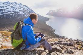 Student hiking mountainside