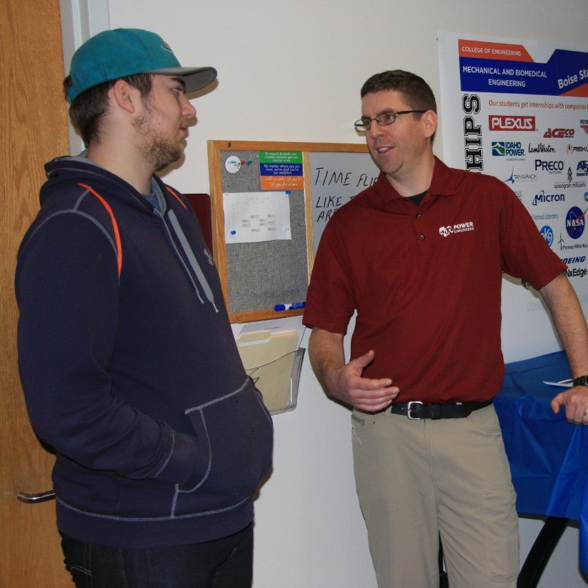 IAB member Tony Clark speaks with visitors at Bronco Day
