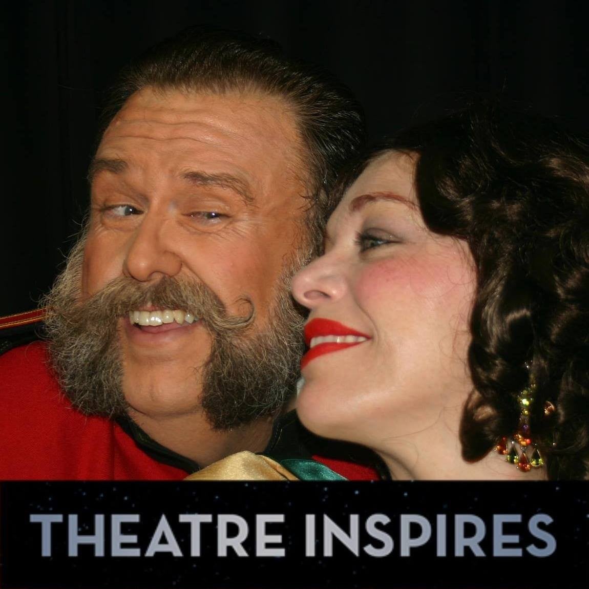 Justin Larson and actress in costume pose for photo