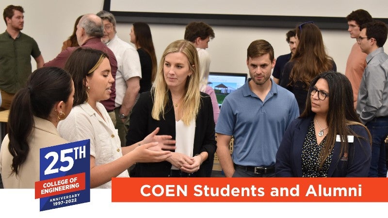 students and faculty networking at an event