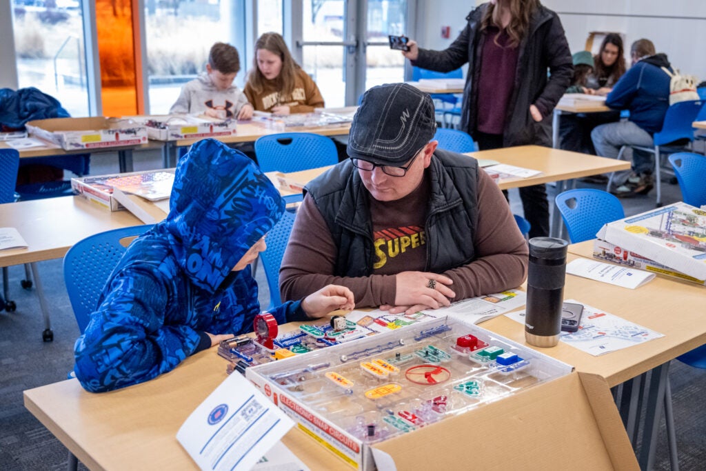 Young student doing circuit board activity at the Engineering and Science Festival