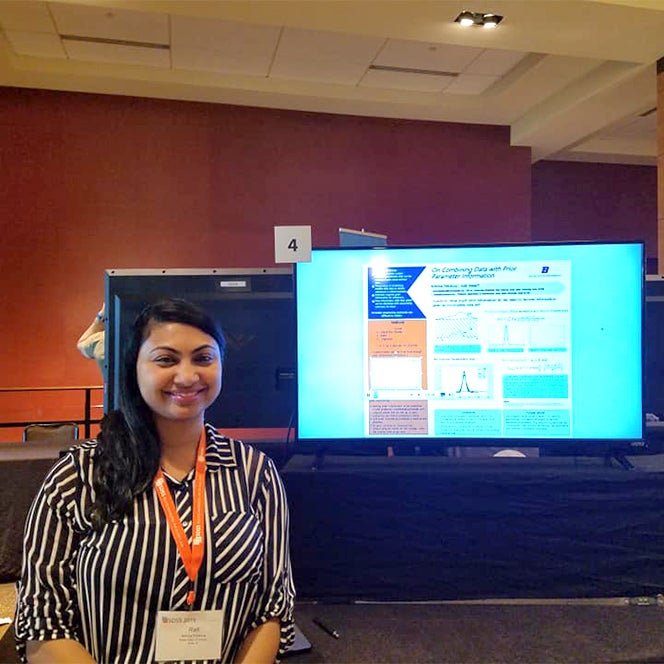 Amrina with her poster at SDSS