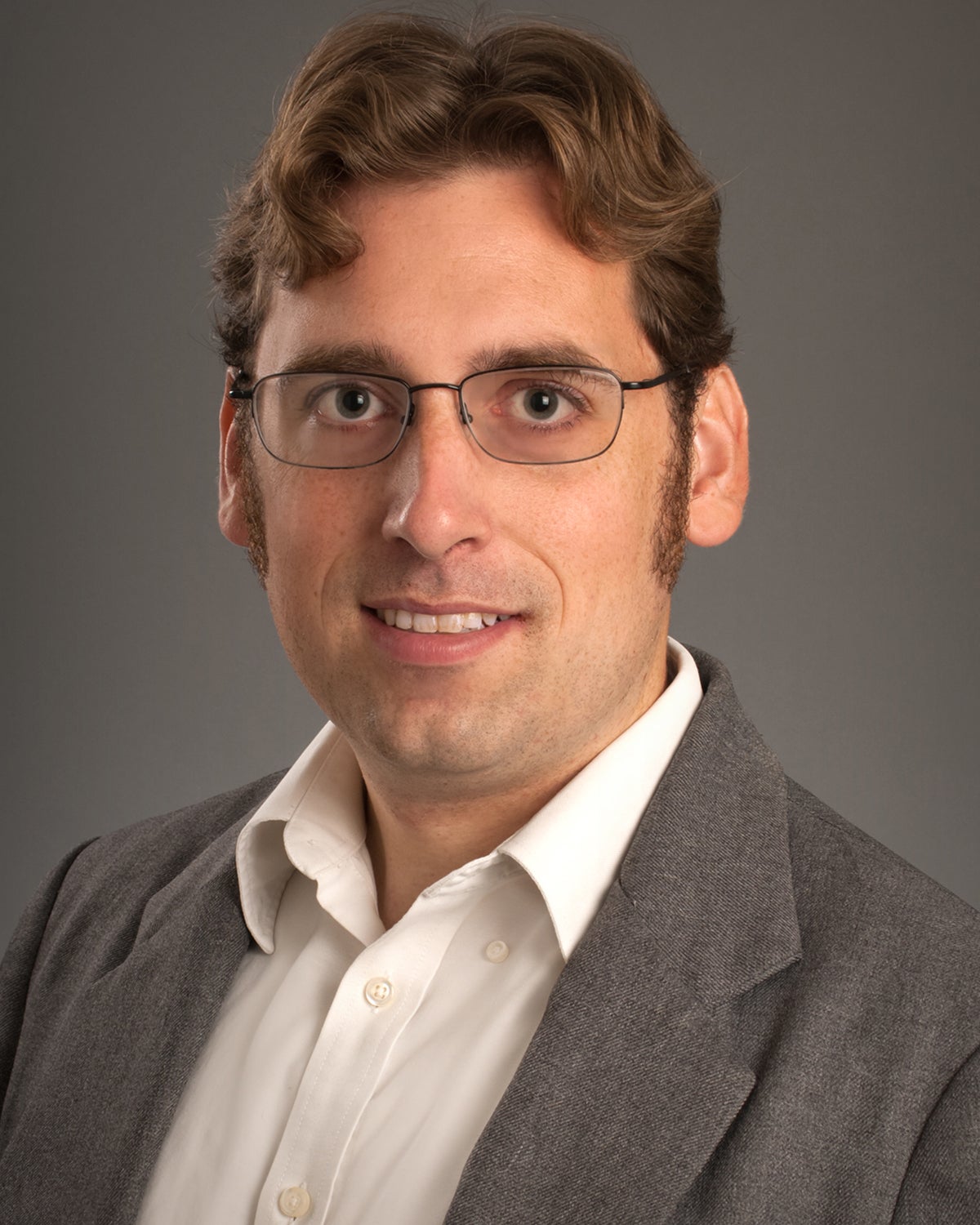 Image of faculty member smiling at camera