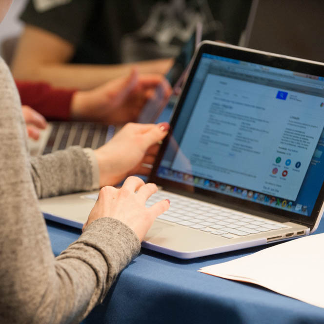 Image of a laptop screen resting on a table