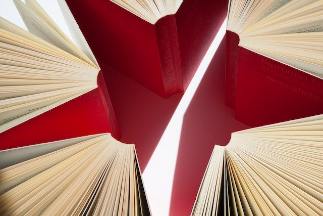 A circle formed by the bindings of five red books