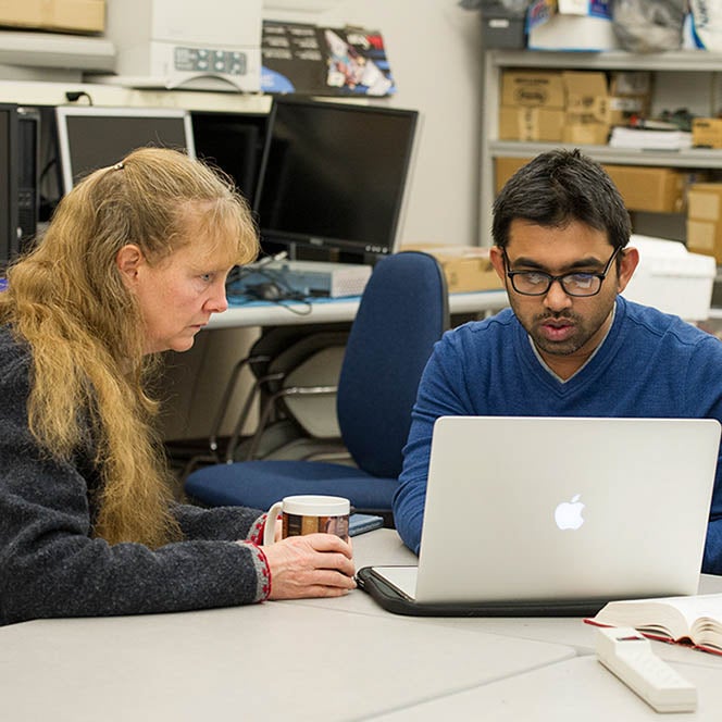 Dr. Barney Smith researching with an Electrical and Computer Engineering PhD student.