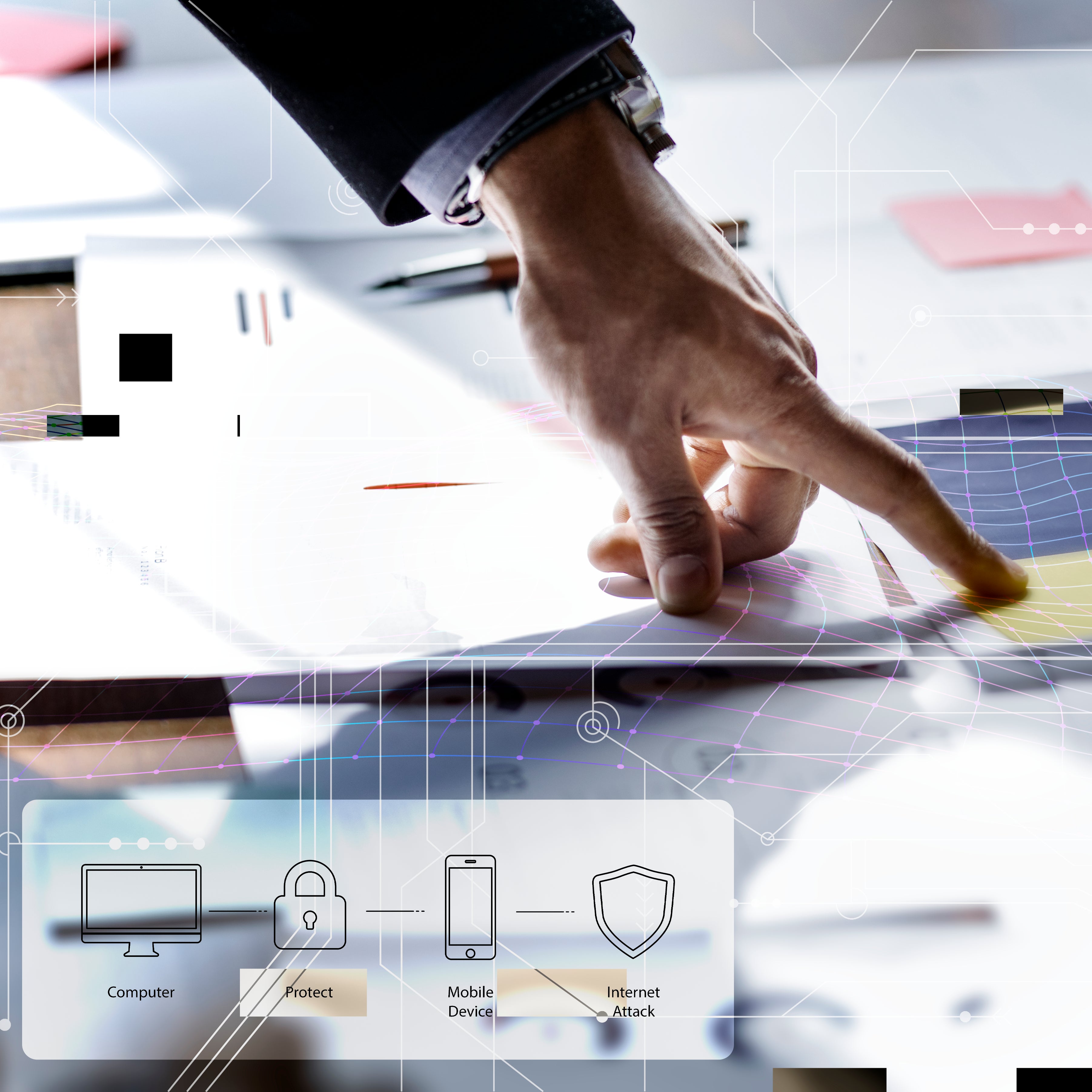 Hand pointing at digital security plan on desk, zoomed in.